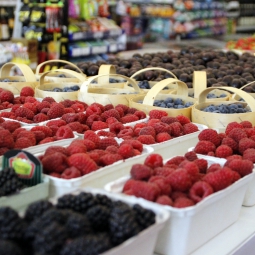 baskets of blackberries, raspberries, and blueberries